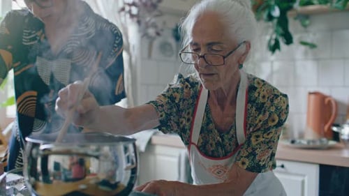 Generations Cooking Together in Bright Home Kitchen