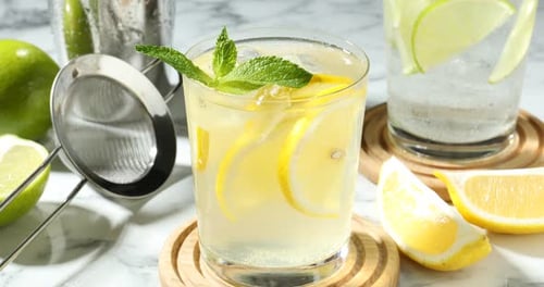 Refreshing Lemonade Drink with Ice Cubes and Mint