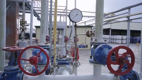 Pipeline with Levers and Meter at Gas Oil Refinery Complex