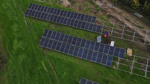 Solar panel technician installing solar panels