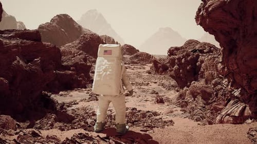 Astronaut on Red Planet Exploring Rocky Martian Landscape