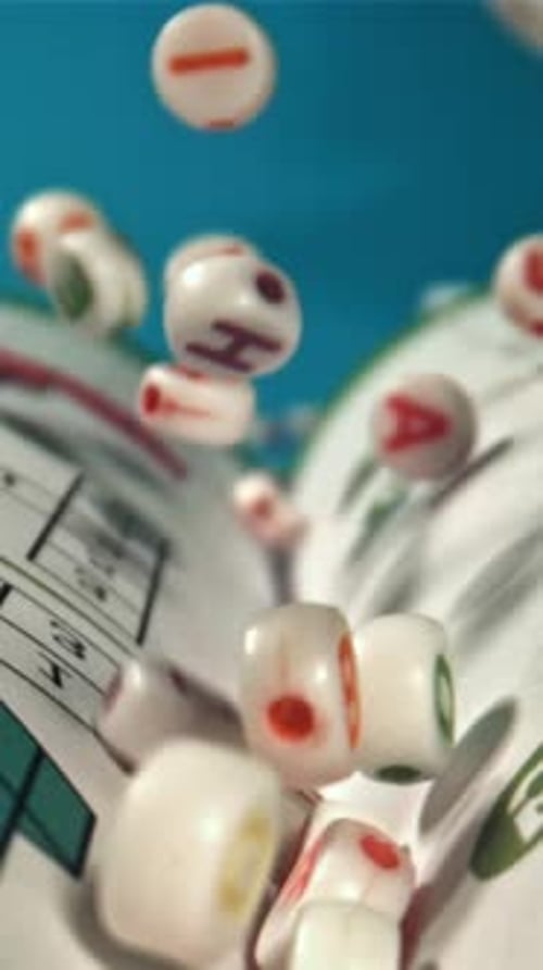 Falling Letters on an Open Textbook Filmed on a Highspeed Camera at 1000 Fps