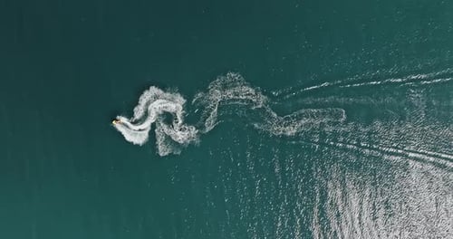 Man riding a jet ski on the sea in summer.