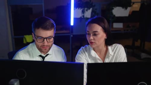 Traders Brokers in Formalwear Analyzing Stock Market Data While Working in the Office