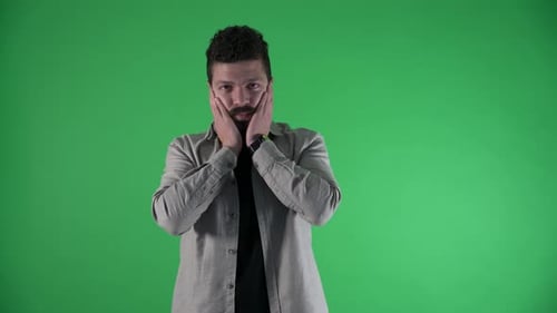 male is holding his head with his hands thinking what to do with anxiety green screen 4k