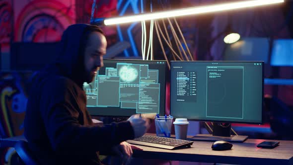 Hooded Hacker Working at Computer Desk at Night, Technology Stock ...
