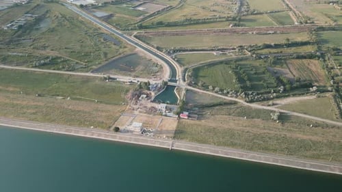 Dam Wall and Rural Agricultural Structures Reservoir in Uzbekistan Top View
