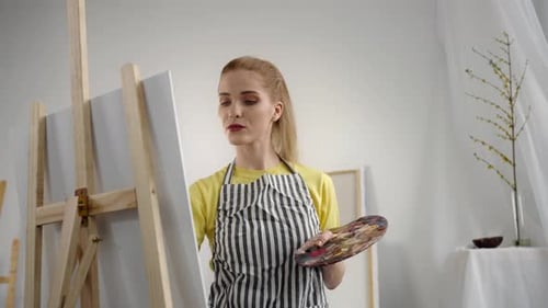 Talented Young Woman Drawing Picture on Canvas in Artist Studio Portrait Happy and Inspired Girl in
