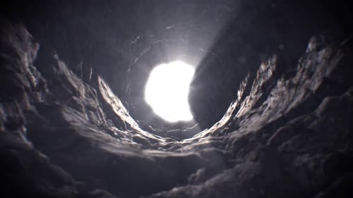 Light Reveal Through Dark Rocky Tunnel