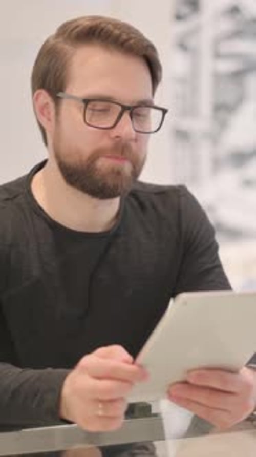 Man Using Tablet Technology Indoors