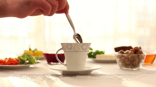 Drinking a Cup of Tea in Breakfast Time