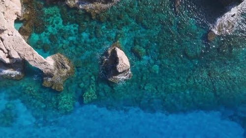 Aerial View of Turquoise Waters and Rocky Coastline in Ayia Napa
