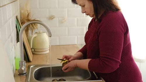 Senior Active Woman Cooking Lunch at Home in Modern Kitchen Healthy Eating Food and Culinary Concept