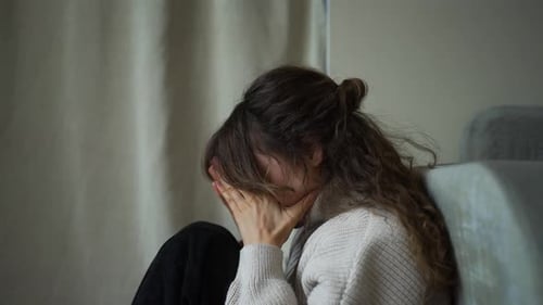 Young Woman Experiencing Sadness and Loneliness
