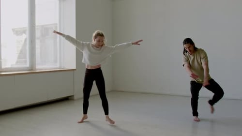 Couple Practicing Ballet Dance while Rehearsing in Studio