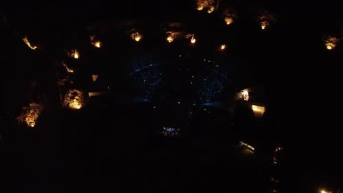 Aerial View of Nighttime Event with Large Crowd
