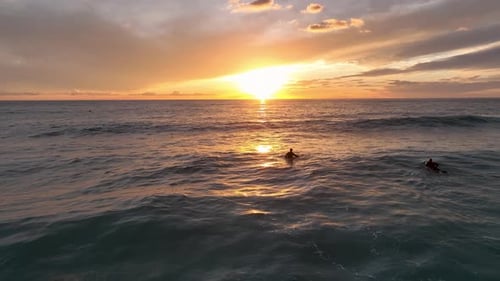 Back View of Man Going to Ocean with Surfboard