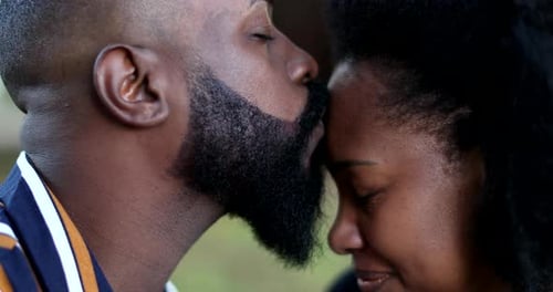 Romantic Couple Kissing with Affection in Outdoor Setting