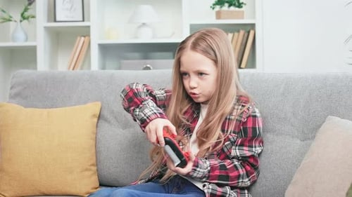 Energetic School Girl Playing Video Game on Console