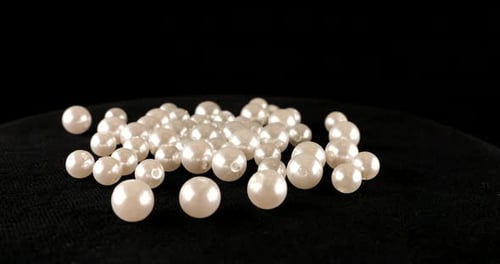 Luminous White Pearls on a Black Background