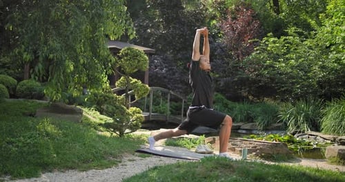 Healthy African American Man Exercising Ar Park Outdoor Practicing Yoga