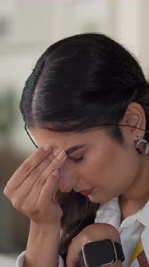 Business woman, headache and pain in office with burnout, audit stress or eye strain