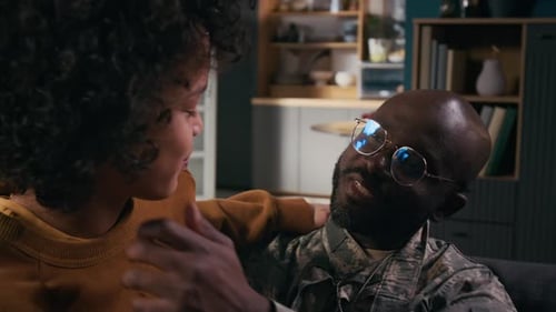 Close Up of Serviceman Talking With Young Woman