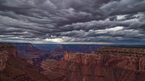 The Majestic and Breathtaking Grand Canyon Lies Beneath a Dramatic and Stunning Sky Above