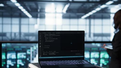 Laptop Used By Data Center System Administrators Using AI Tech Close Up