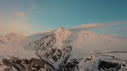 Snowy Mountain Peaks Under Sky at Sunrise