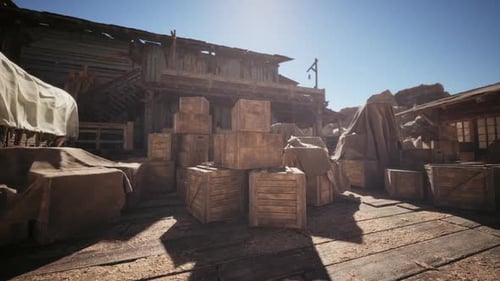 Wooden Crates By a Rustic Building in a Bright Western Landscape