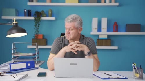 Home office worker man thinking about private life problems.