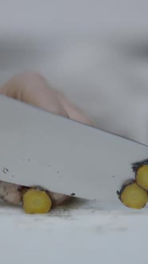 Chef Slices Vegetables on Restaurant Kitchen Counter Slomo Closeup