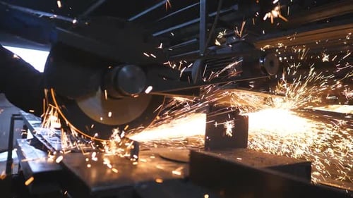 Close Up of Saw Cutting Machine Cut Metal Many Bright Sparks Fly From Hot Metal Circular Saw Sawing