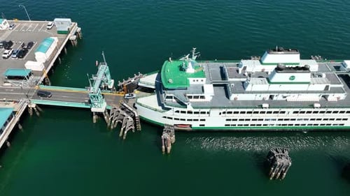Aerial view of cars loading onto a WA State ferry.