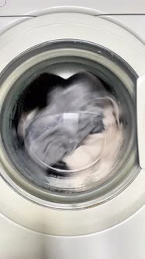 Washing Machine Spinning with Clothes in Vertical Video