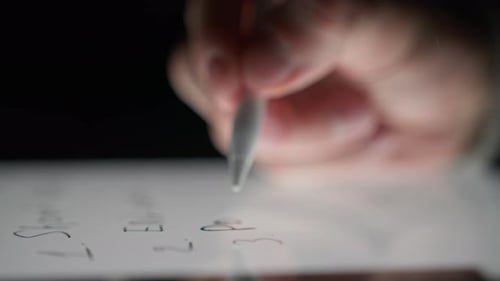 Writing on a Tablet with Stylus Close Up