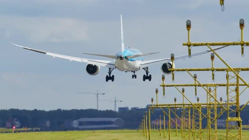 Large Passenger Plane is Approaching and Landing on the Runway