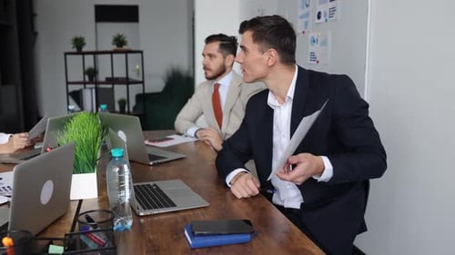 Team Discussing Business at Conference Table