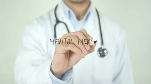 Doctor Writes 'Mental Health' on Clear Surface