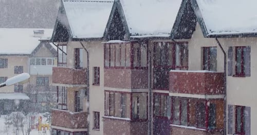 Mesmerizing Footage of Quiet Snowfall in a Small Residential Area