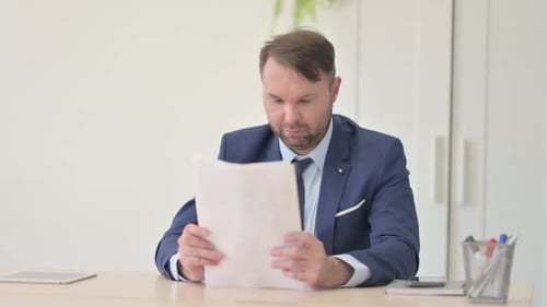 Adult Reviews Charts at Office Desk