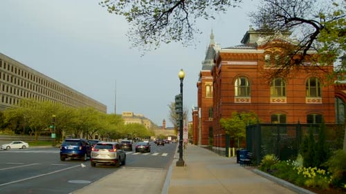 The shot pans left from the Smithsonian Castle to the Department of Energy across Independence Avenu