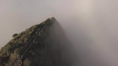 Oahu's Haiku Stairs descend into cloud