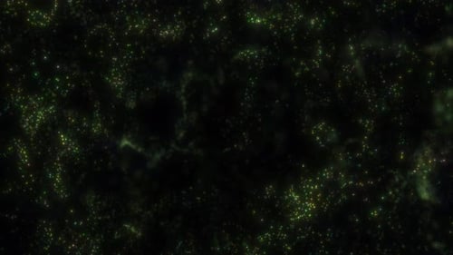 Abstract green luminous particles scattered across dark background