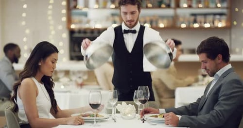 4k video footage of a happy young couple having a romantic date at a fancy restaurant