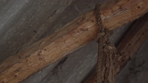 Hemp Rope Hanging From the Top Of A Barn Moving Slowly