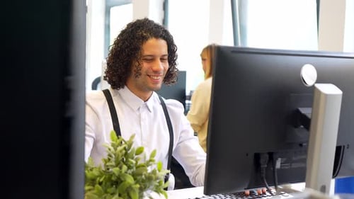 Coworkers Having Fun Using a Computer Together