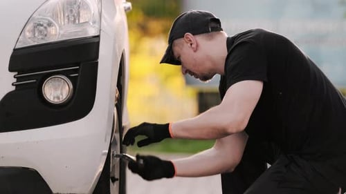 Mechanic Fixes Car