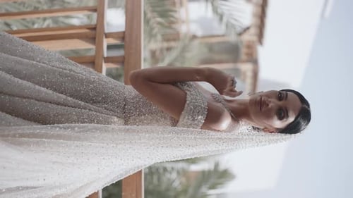 Elegant Woman in Wedding Gown Posing Gracefully